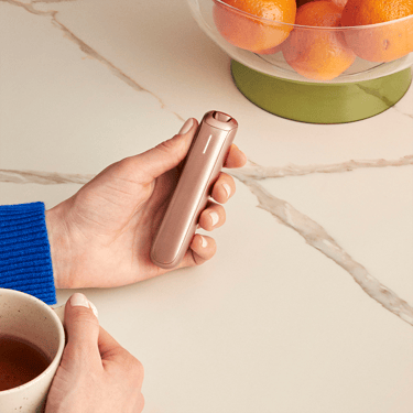 The sleek Ploom AURA Rose Gold deviceis a discreet companion always with you