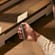 Ploom AURA front panel Lunar Silver accessory attached to device.